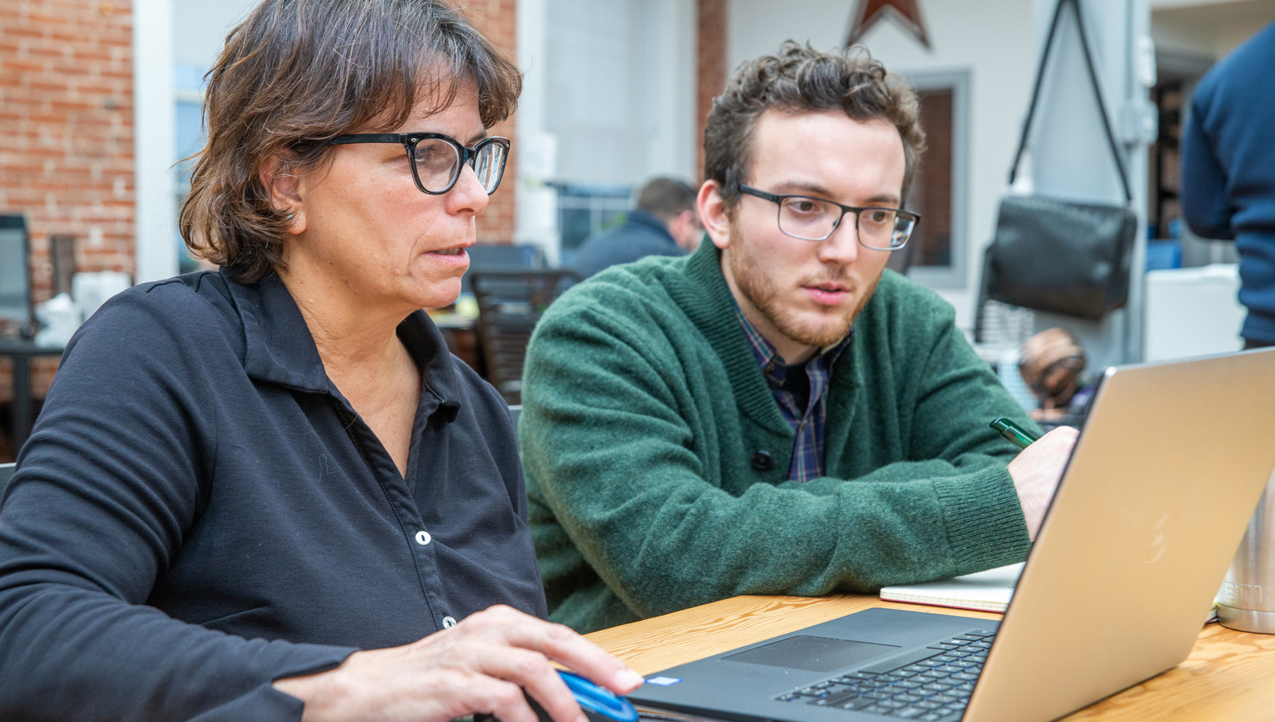 Joe and Sue strategize at the FourFront office