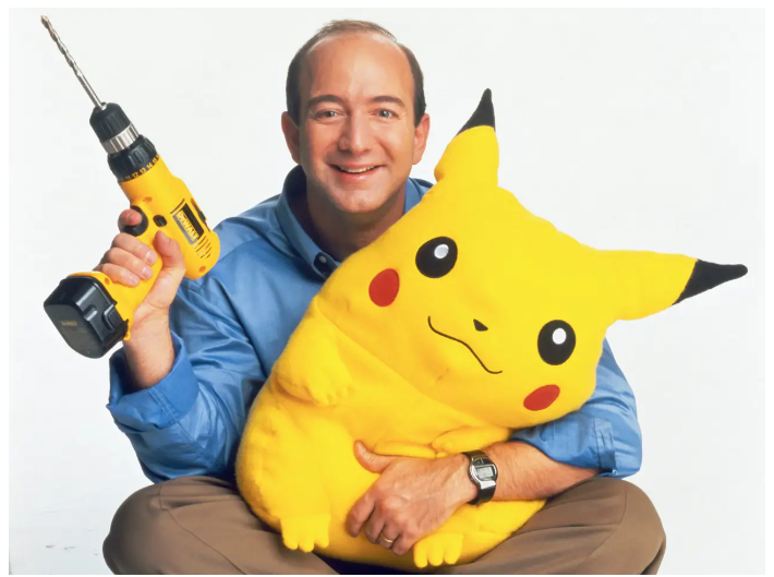 Amazon Founder Jeff Bezos holding a plush Pikachu toy.